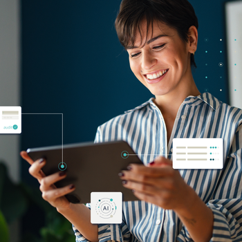 A woman looks smiling at her screen and a logo in the upper left corner says AI